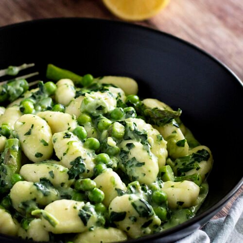 A bowl of Gnocchi Primavera with Creamy Parmesan Sauce